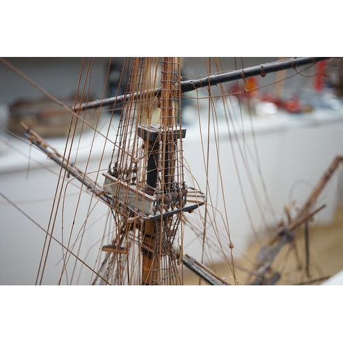 1289 - A large model of a rigged ship, 84cm long. Condition - fair