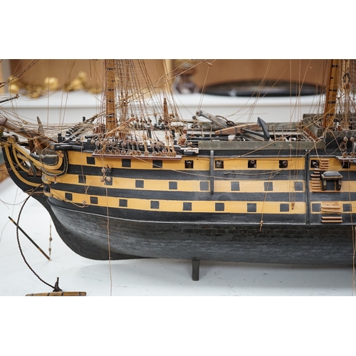 1289 - A large model of a rigged ship, 84cm long. Condition - fair