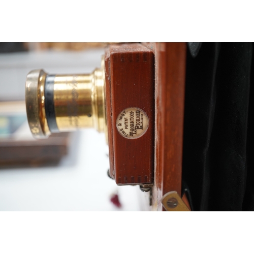 1291 - A late 19th/early 20th century brass and mahogany half plate bellows camera with a lens and a shutte... 