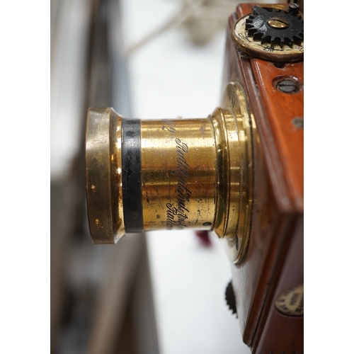 1291 - A late 19th/early 20th century brass and mahogany half plate bellows camera with a lens and a shutte... 