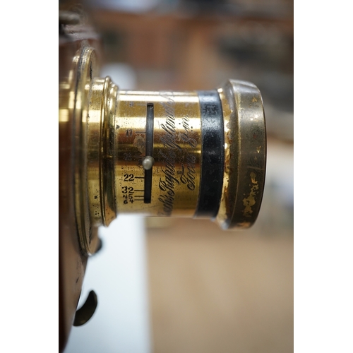 1291 - A late 19th/early 20th century brass and mahogany half plate bellows camera with a lens and a shutte... 