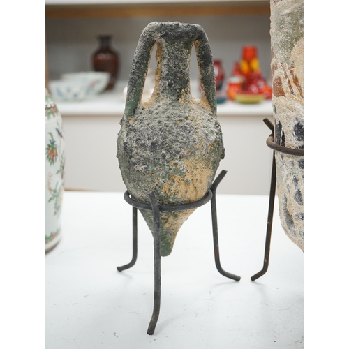 1299 - Two pottery amphora on metal stands, tallest 43cm high. Condition - as on line images