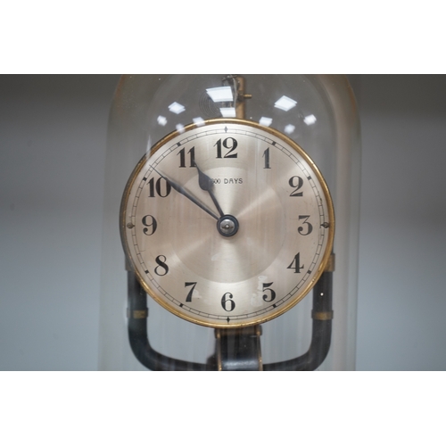 1309 - A Bulle type 800 day electric clock, under a glass dome, 26cm high. Condition - fair, untested... 