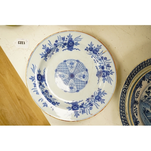 1323 - Five 18th century Delft dishes, largest 36.5cm diameter. Condition - poor to fair