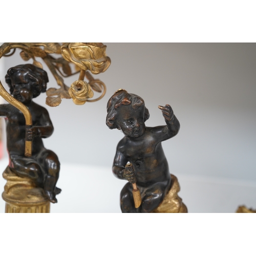 1329 - A pair of Louis XVI style bronze, ormolu and white marble figural candelabra, late 19th century, 28c... 