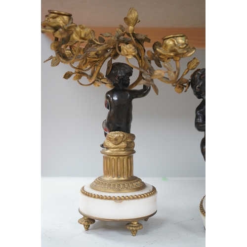 1329 - A pair of Louis XVI style bronze, ormolu and white marble figural candelabra, late 19th century, 28c... 