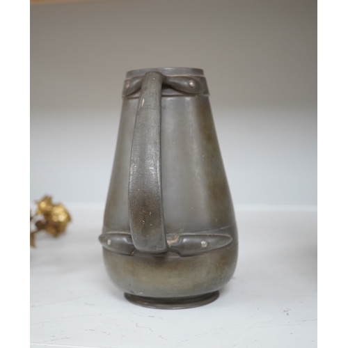 1330 - A Liberty Tudric pewter water jug, 17cm high. Condition - fair