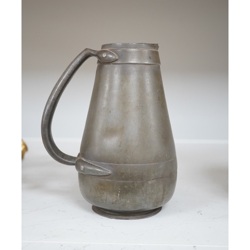 1330 - A Liberty Tudric pewter water jug, 17cm high. Condition - fair