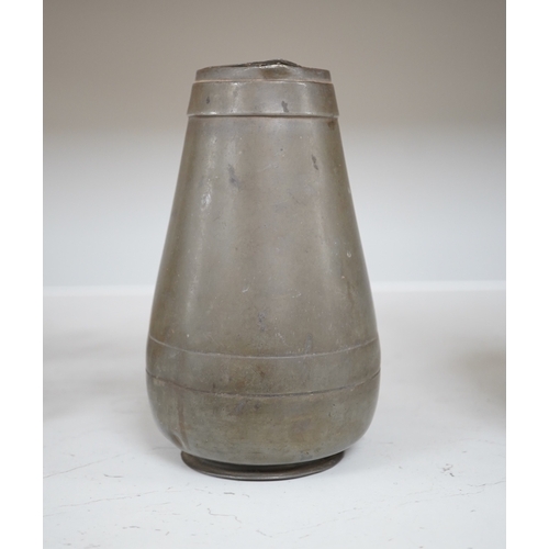 1330 - A Liberty Tudric pewter water jug, 17cm high. Condition - fair