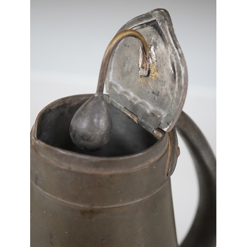 1330 - A Liberty Tudric pewter water jug, 17cm high. Condition - fair