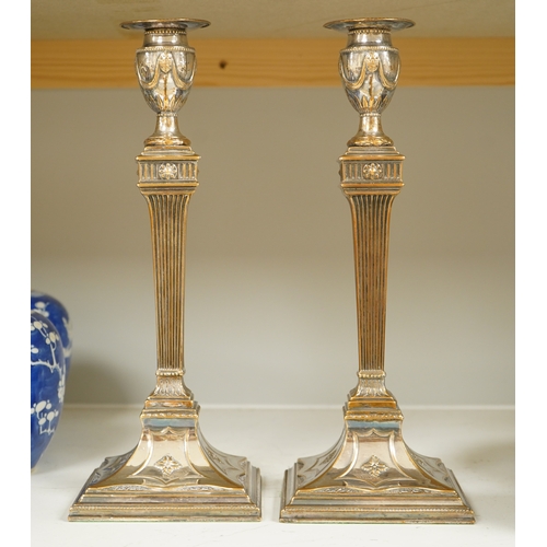 1333 - A pair of Adam design silver plated candlesticks, 31.5cm. Condition - worn otherwise good