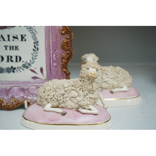 1335 - An 19th century Sunderland pink lustre wall plaque and two Staffordshire-style models of recumbent s... 