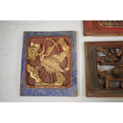 1340 - Three Chinese gilded and lacquered wood panels, early 20th century, longest 31cm. Condition - fair... 