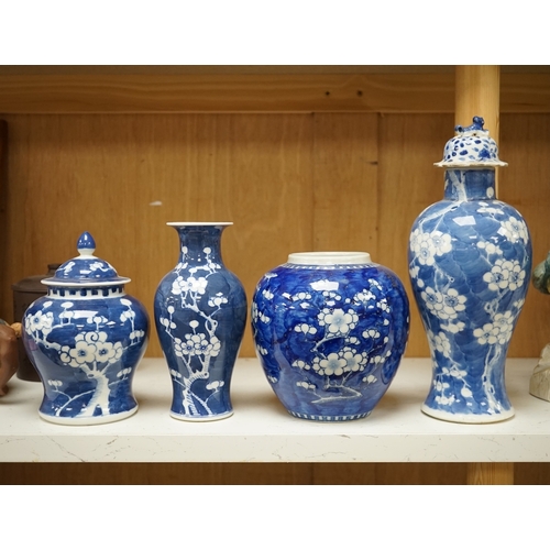 1350 - Two Chinese prunus jars and two vases, early 20th century, tallest 26cm, together with two Chinese Y... 