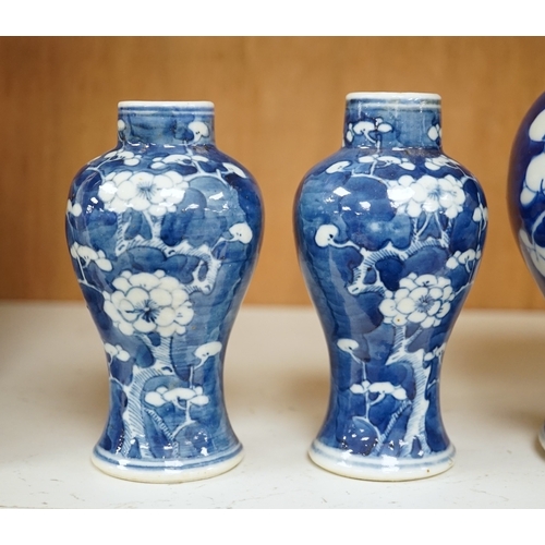 1359 - A group of five Chinese blue and white prunus vases, one with cover, late 19th century, tallest 20cm... 