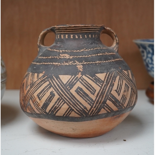 1362 - A Chinese neolithic pottery two handled jar - 14cm tallProvenance: the vendors parents lived in Hon... 