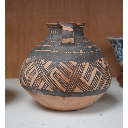 1362 - A Chinese neolithic pottery two handled jar - 14cm tallProvenance: the vendors parents lived in Hon... 