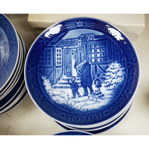 1368 - A large collection of Royal Copenhagen Christmas plates to include In the old farmyard, 1969 and In ... 