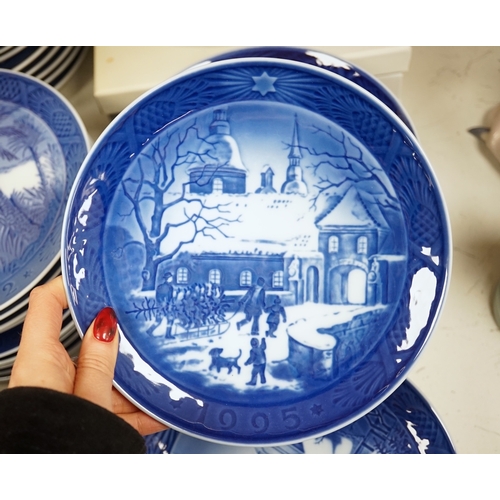 1368 - A large collection of Royal Copenhagen Christmas plates to include In the old farmyard, 1969 and In ... 