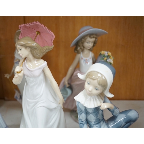 1369 - A group of Lladro figures to include Lamplighter and All aboard, largest 48cm high. Condition - ... 