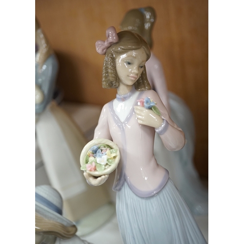 1369 - A group of Lladro figures to include Lamplighter and All aboard, largest 48cm high. Condition - ... 