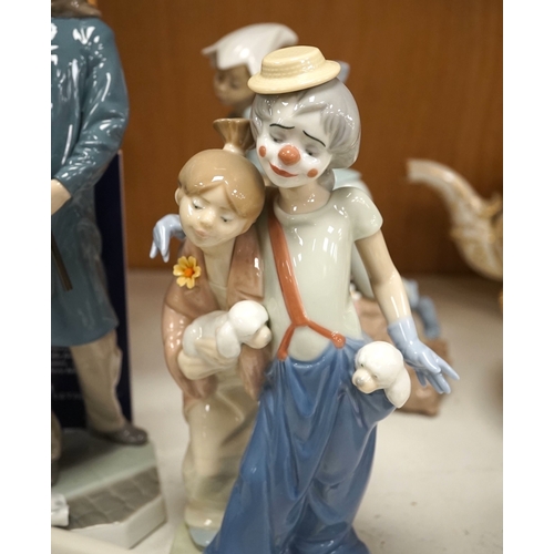 1369 - A group of Lladro figures to include Lamplighter and All aboard, largest 48cm high. Condition - ... 