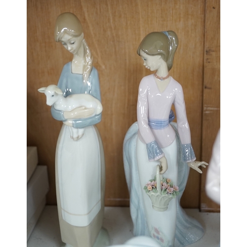 1369 - A group of Lladro figures to include Lamplighter and All aboard, largest 48cm high. Condition - ... 