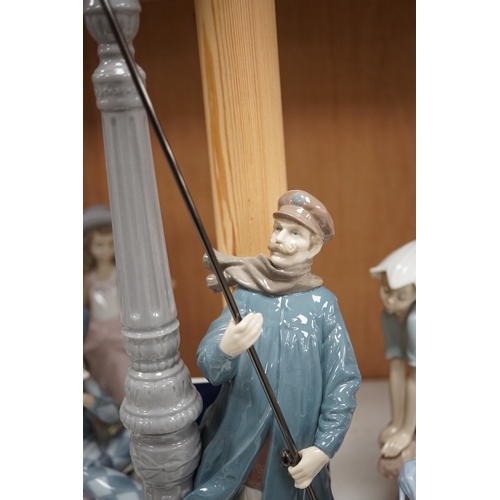 1369 - A group of Lladro figures to include Lamplighter and All aboard, largest 48cm high. Condition - ... 