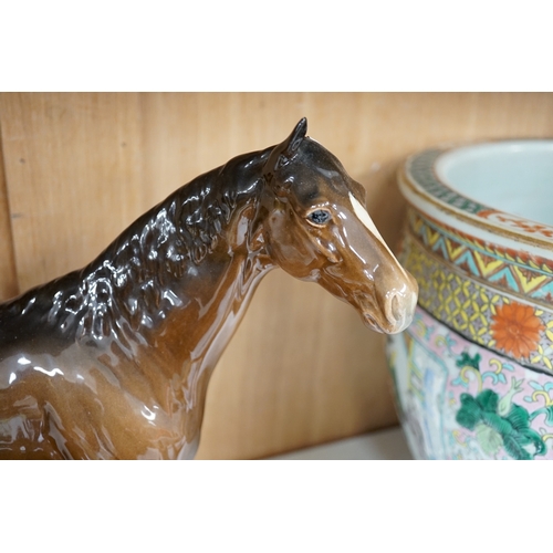 1378 - A large Beswick Chestnut horse, together with three other smaller horses and an Exmoor pony, tallest... 