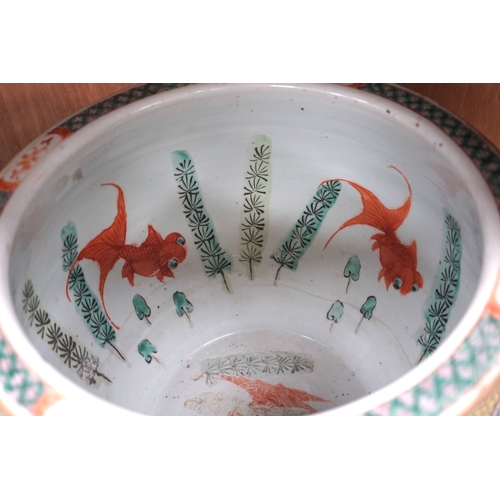 1379 - A Chinese famille rose goldfish bowl, Guangxu period, 25cm high. Condition - repaired