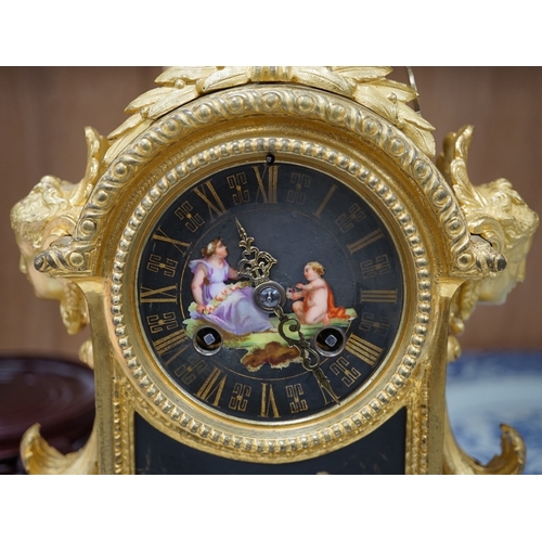 1382 - A French ormolu, black figural porcelain mounted mantel clock, 28cm wide x 36cm high. Condition - fa... 