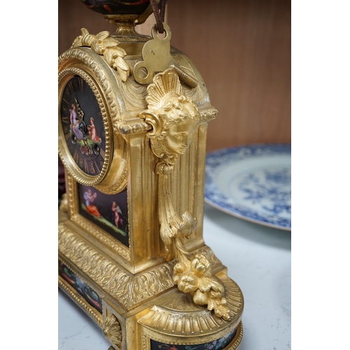 1382 - A French ormolu, black figural porcelain mounted mantel clock, 28cm wide x 36cm high. Condition - fa... 