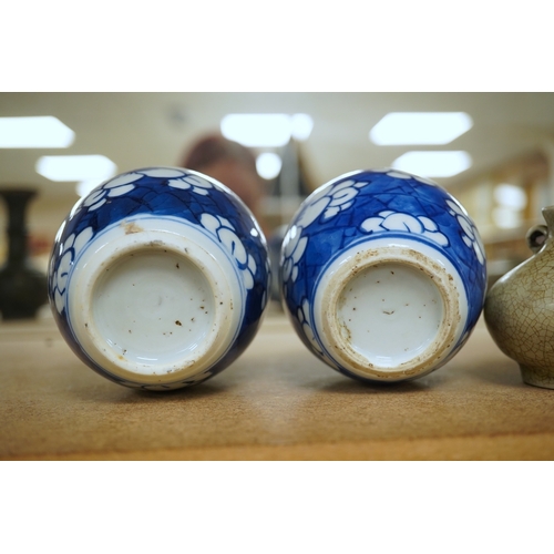 1391 - Two small Chinese blue and white prunus jars, Kangxi period, tallest 9.5cm. Condition - good