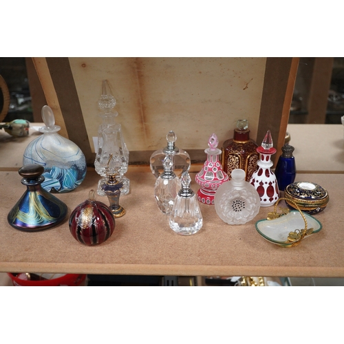 1403 - A collection of various glass scent bottles including a Lalique flower scent bottle and Bohemian exa... 