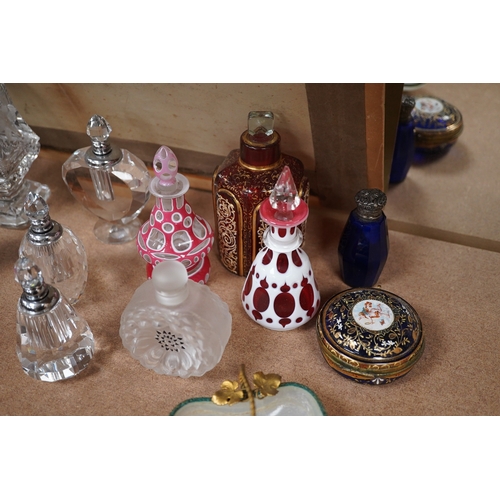 1403 - A collection of various glass scent bottles including a Lalique flower scent bottle and Bohemian exa... 