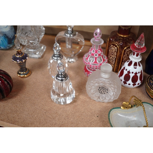 1403 - A collection of various glass scent bottles including a Lalique flower scent bottle and Bohemian exa... 