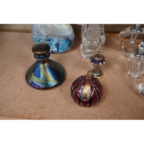 1403 - A collection of various glass scent bottles including a Lalique flower scent bottle and Bohemian exa... 