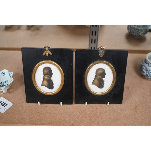 1406 - Miers & Field, two bronzed painted plaster silhouettes of gentlemen, framed. Condition - good