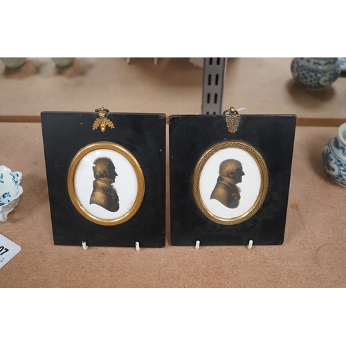 1406 - Miers & Field, two bronzed painted plaster silhouettes of gentlemen, framed. Condition - good