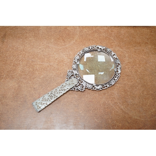 1412 - A Chinese white metal and pale celadon jade handled magnifying glass, early 20th century, stamped S... 