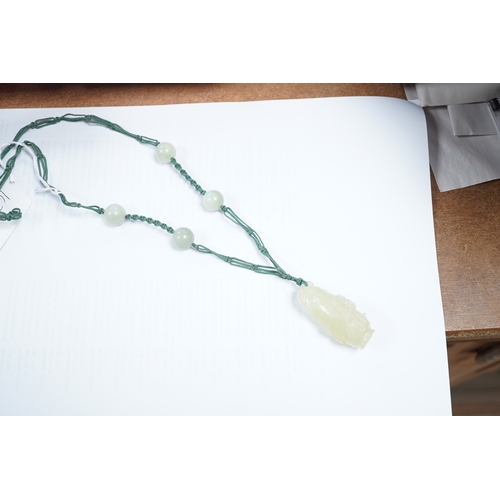 1416 - A Chinese bowenite jade pendant and bead necklace. Condition - fair to good