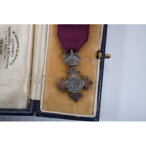 1423 - A cased George V military MBE containing leaflet with instructions as to wearing Insignia, together ... 