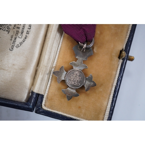 1423 - A cased George V military MBE containing leaflet with instructions as to wearing Insignia, together ... 