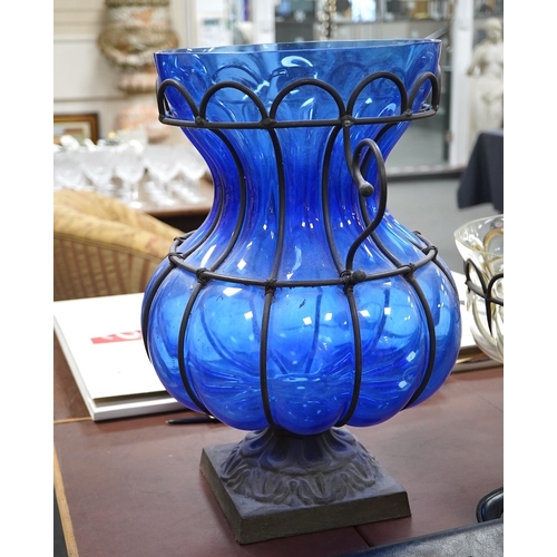 1449 - A wrought and cast iron mounted large blue glass vase, 49cm. Condition - would benefit from a clean,... 