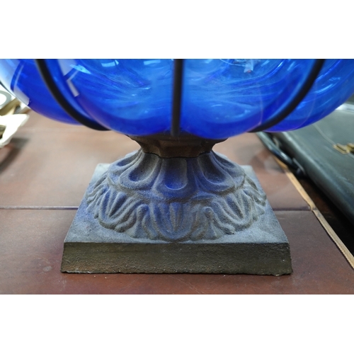 1449 - A wrought and cast iron mounted large blue glass vase, 49cm. Condition - would benefit from a clean,... 