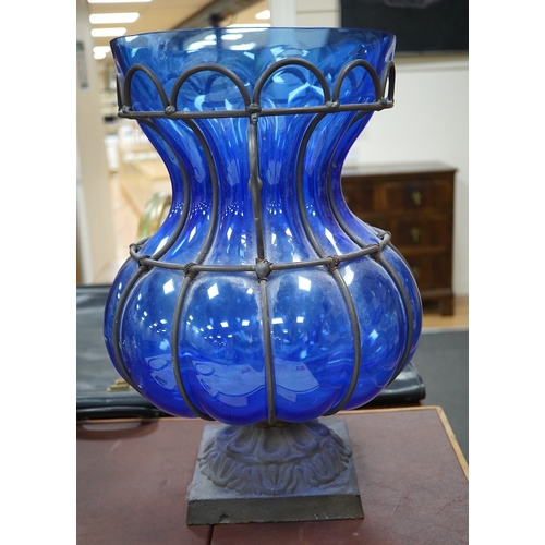 1449 - A wrought and cast iron mounted large blue glass vase, 49cm. Condition - would benefit from a clean,... 