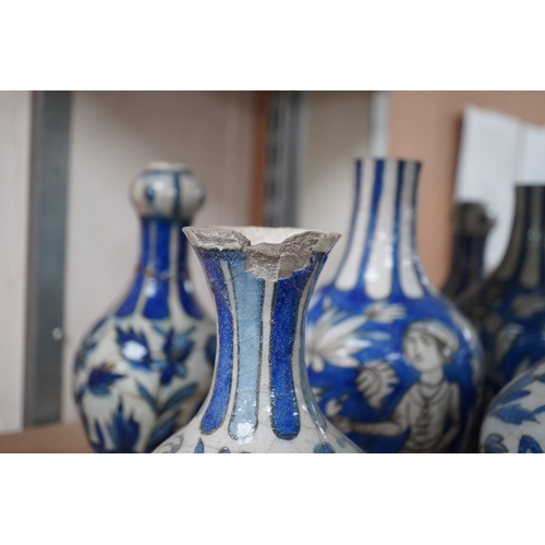 1469 - A large collection of Persian, predominantly blue and white, guglets, 18th century, largest 21.5cm. ... 