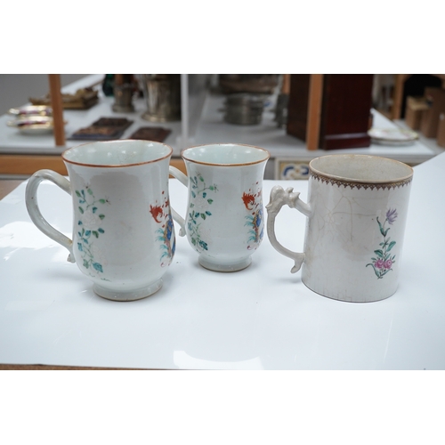 1475 - Three 18th century Chinese export armorial mugs, largest 14cm high. Condition - all restored