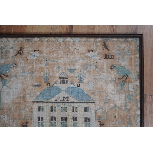 1502 - A framed 18th century sampler, dated 1779 by SS., worked in fine cross stitch with motifs of angels,... 