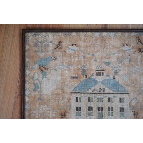 1502 - A framed 18th century sampler, dated 1779 by SS., worked in fine cross stitch with motifs of angels,... 